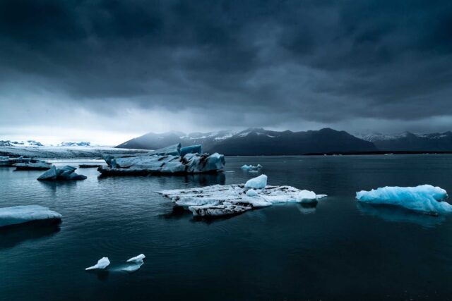 glacier near body of water