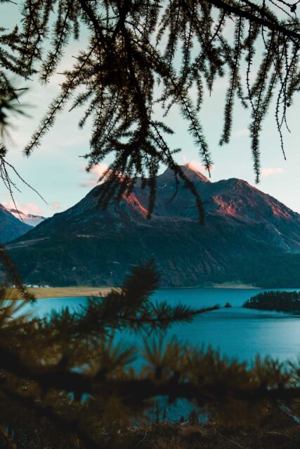 mountain beside body of water