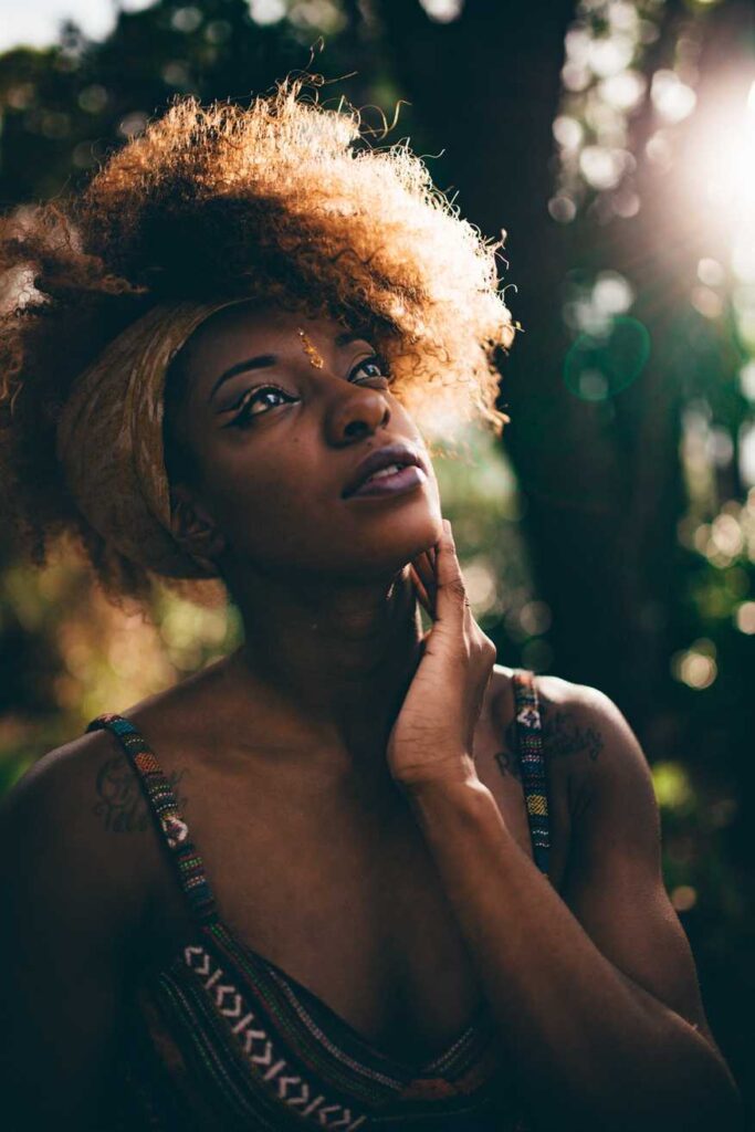 woman in tribal print tank top near trees