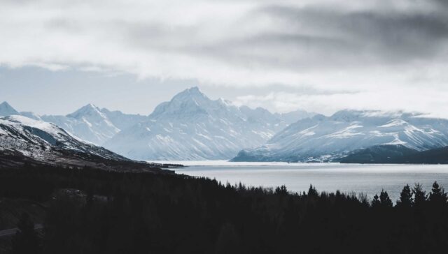 snow covered mountains and trees during daytime