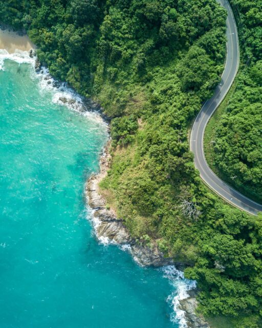 bird’s eye photography of road near near body of water