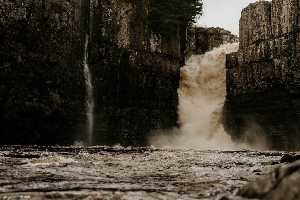 water falls on rocky mountain