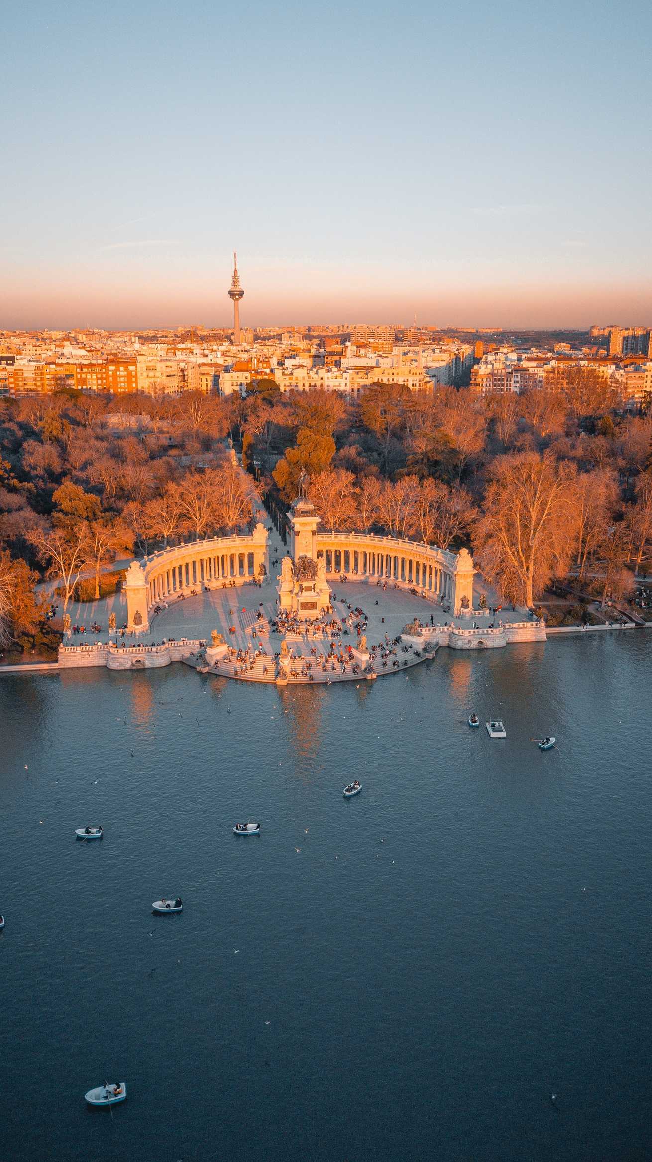 aerial view of white and brown building near body of water during daytime